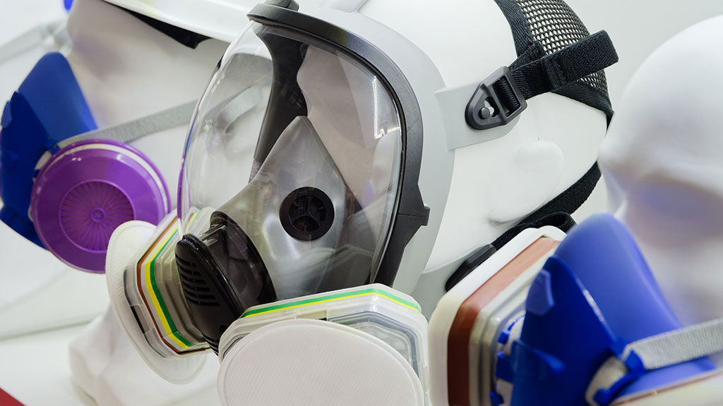 Assorted PPE respiratory masks fitted to mannequins