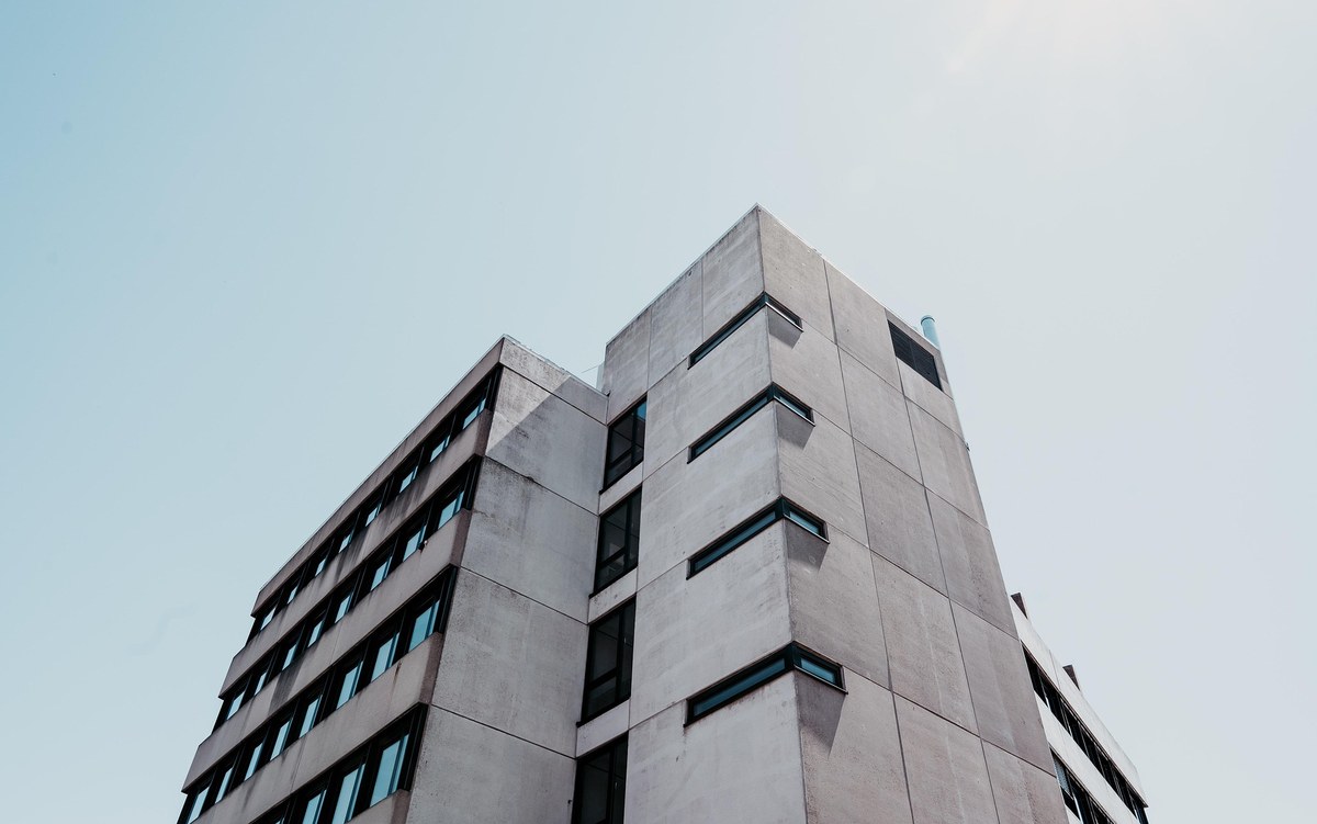 Concrete multi-storey building viewed from below