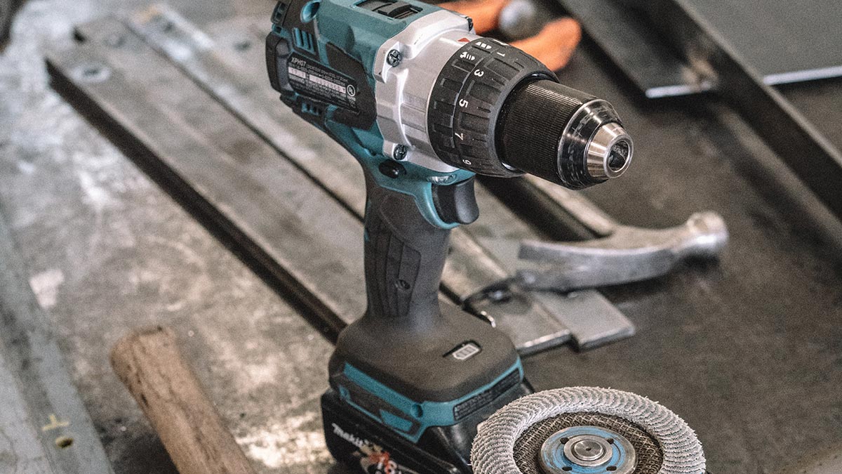 A cordless drill on a workbench