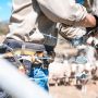 Man with tool belt constructing fence with joiner