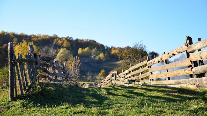 broken wooden fence on farm